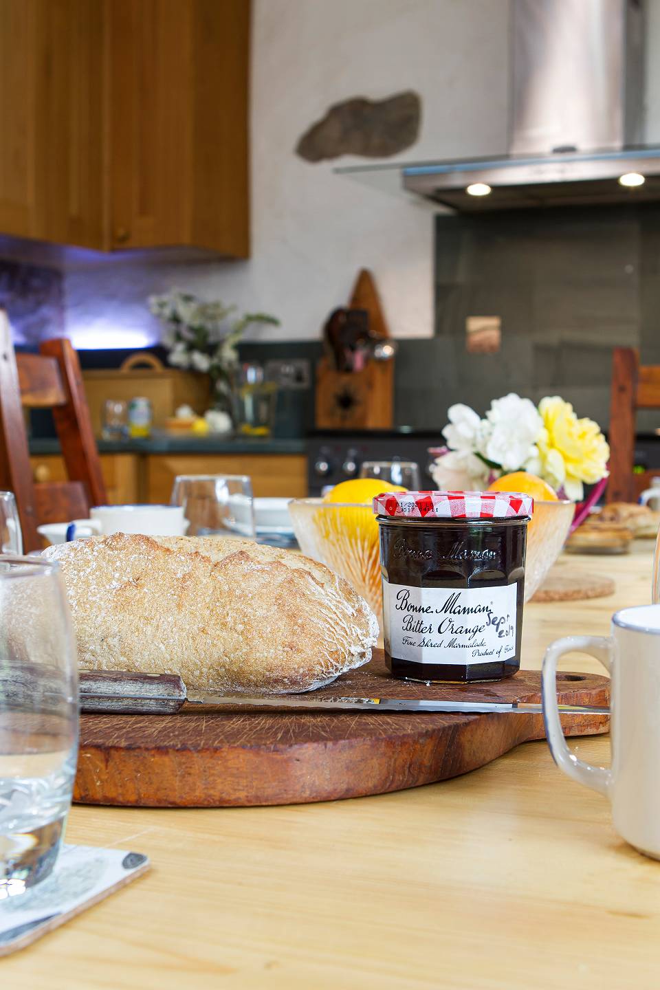 A close up of bread and jam on the kitchen table