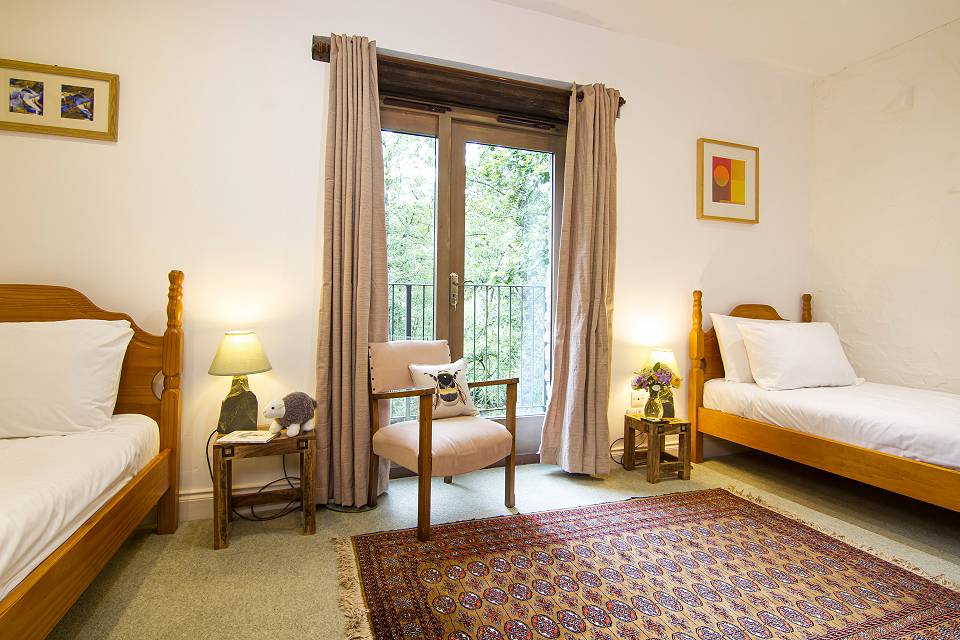 Bedroom with twin beds and chair