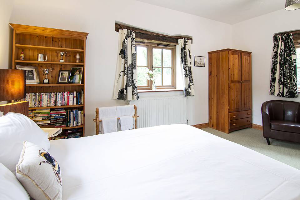 Bedroom with wardrobe and chair