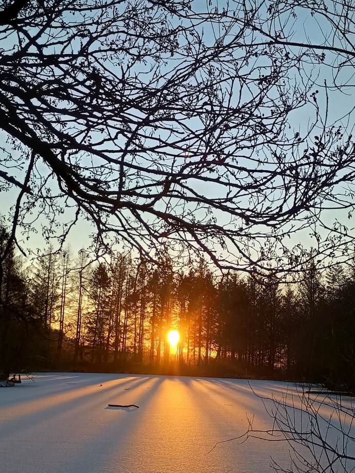 Winter sunset on the frozen lake