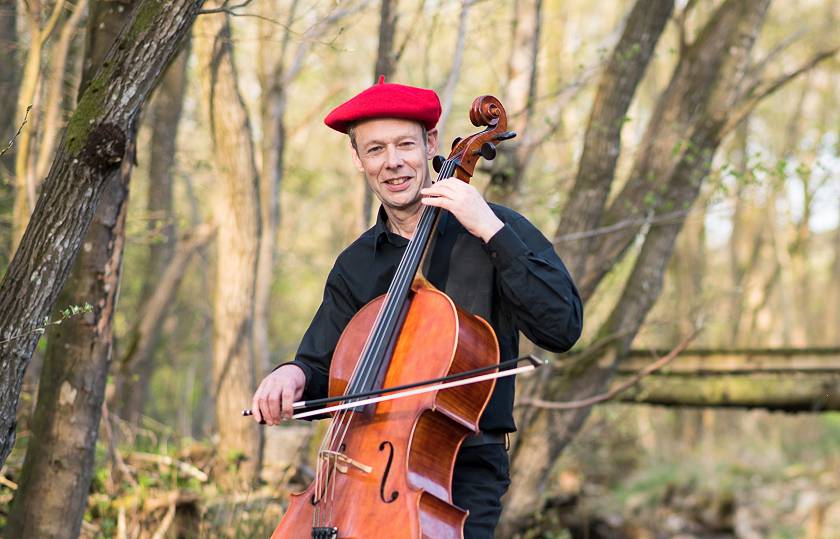 Kenneth Wilson "Highway Cello" playing a cello
